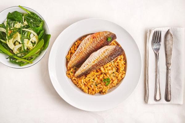 Langoustine bisque risotto met vis van de dag